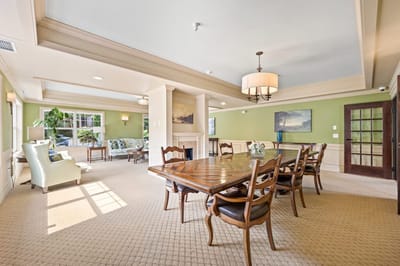 Bright common area with seating and dining table