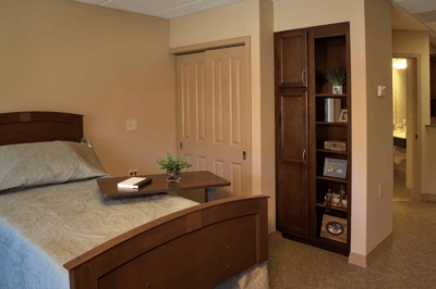 Cozy private resident room with bedside table