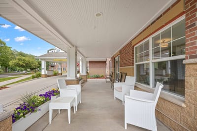 Outdoor seating area with flowers and chairs