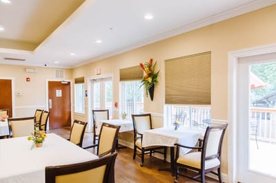 Bright dining area with tables and plants