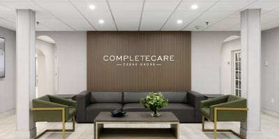 Modern lounge area with facility logo on the wall