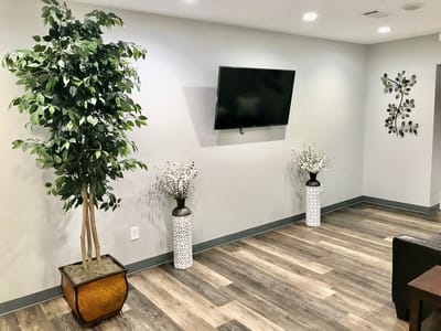Interior view of a common area with plants and decor