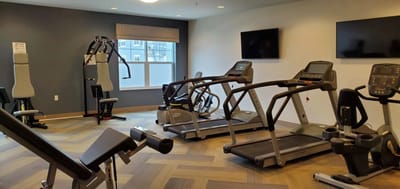 Interior view of a fitness area with exercise equipment