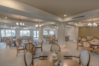 Bright dining area with round tables and chairs