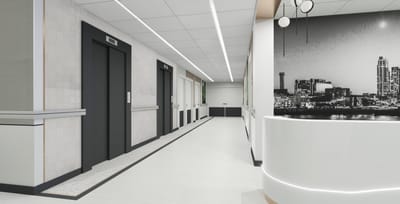 Modern interior hallway with elevators and reception