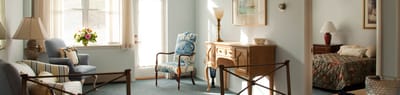 Cozy resident room with natural light and furnishings