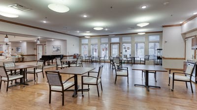 Bright dining area with tables and chairs arranged neatly
