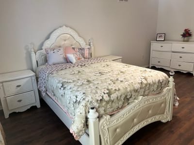 Brightly decorated bedroom with floral bedding