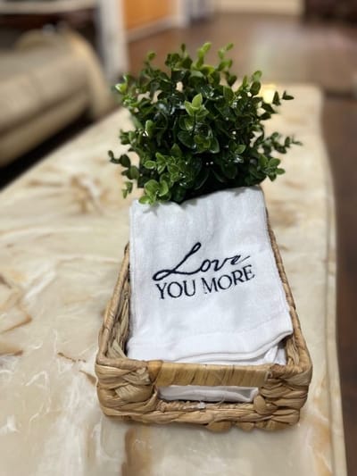Decorative towel and plant arrangement in a common area