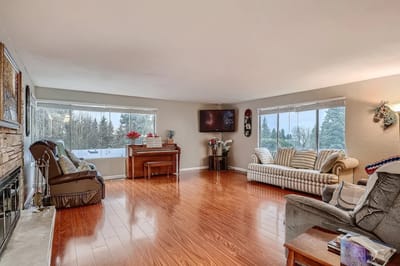 Bright common area with seating and piano