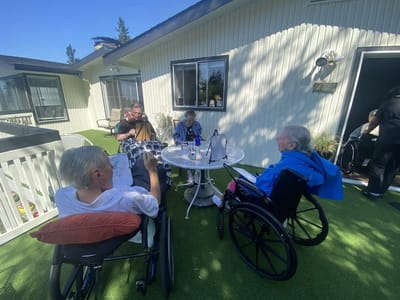 Residents enjoying an outdoor gathering with live music
