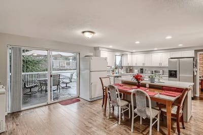 Bright kitchen area with dining table and outdoor view