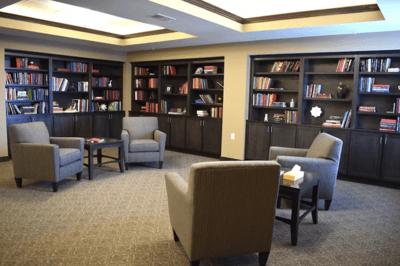 Cozy reading area with bookshelves and seating