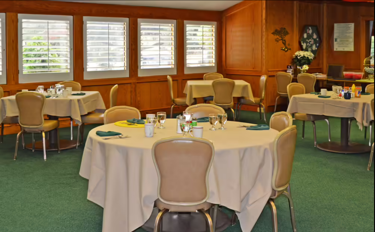 Dining room set up for a meal with tables