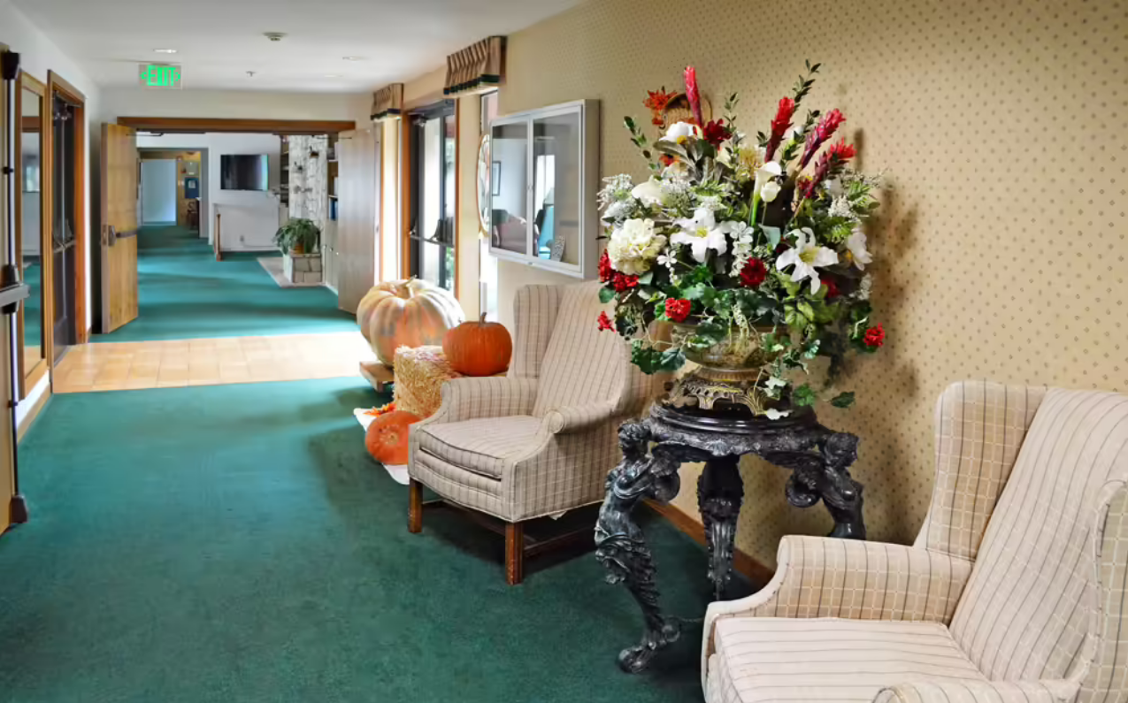 Interior hallway with floral arrangement and seating