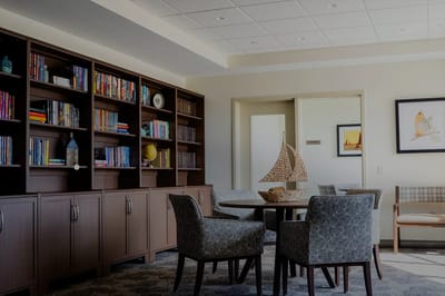 Common area with bookshelves and seating