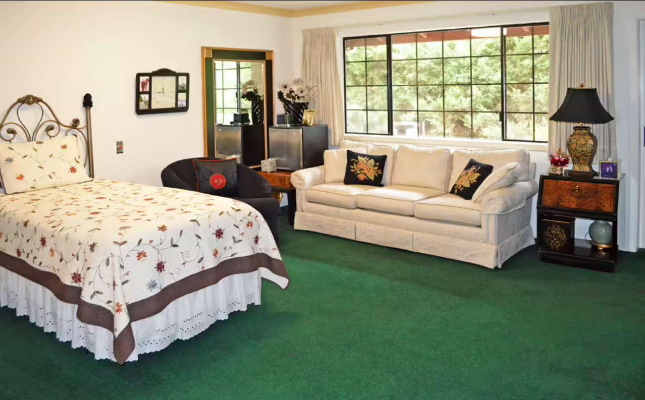 Cozy resident room with bed and seating area
