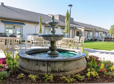Beautiful outdoor space with a fountain and seating