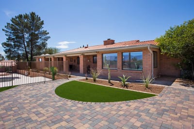 Exterior view of Desert Gardens Assisted Living with landscaped yard