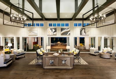 Well-furnished interior common area with large windows