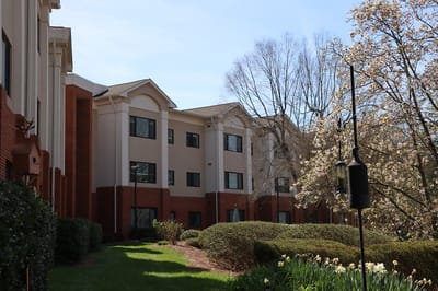 Exterior view of the facility showing landscaping and building facade