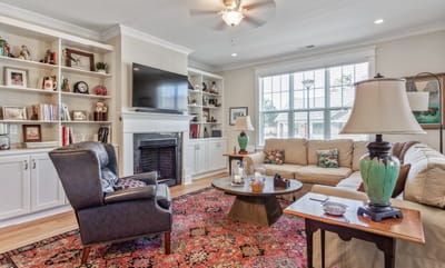 Cozy common area with comfortable seating and bookshelves