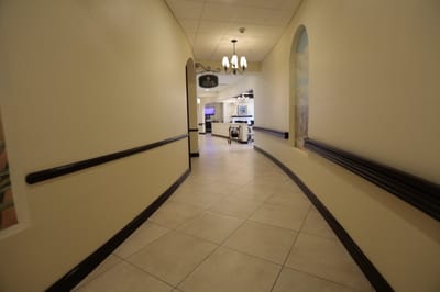 A well-lit corridor leading to a social area