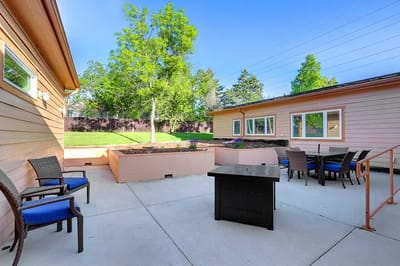 Outdoor seating area with planters and garden
