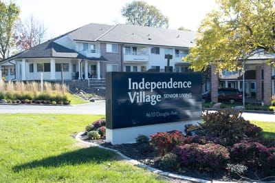 Exterior view of Independence Village with signage