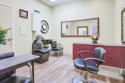 Interior beauty salon with styling chairs and mirrors