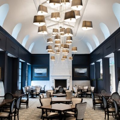 Stylish dining room with modern lighting and tables