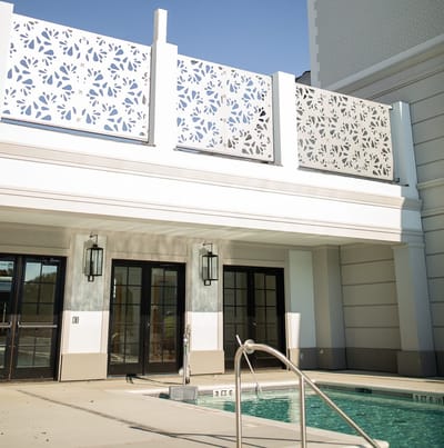 Outdoor pool area with decorative fencing
