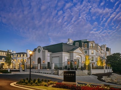 Exterior view of Corso Atlanta with gardens and a blue sky