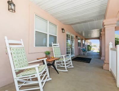 Seating area with rocking chairs on a covered porch