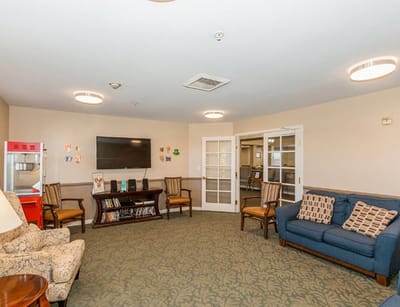 A cozy common area with seating and entertainment