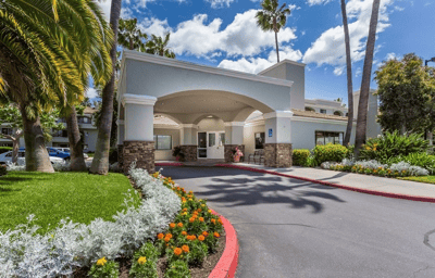 Exterior view of Las Villas del Norte entrance and landscaping