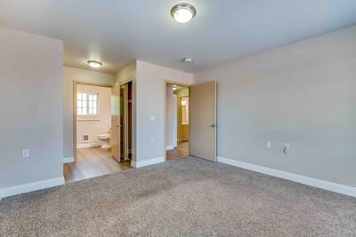 Interior view of a private resident room with bathroom