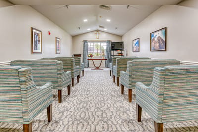 Bright common area with seating and large windows