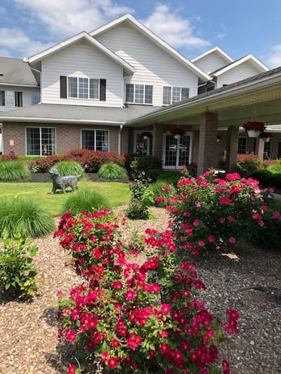 Exterior view of assisted living facility with landscaping