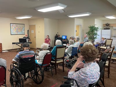 Residents enjoying a live music performance in a common area