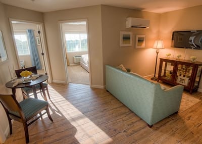 Cozy interior of a resident's room with a seating area