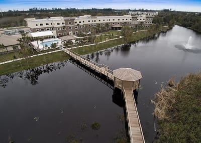 Aerial view of the facility with outdoor space and water features