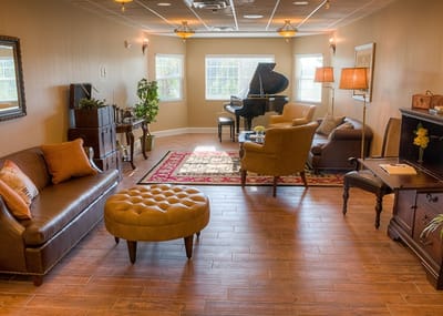 Cozy common area with seating and piano