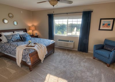 Cozy resident room with bed and window