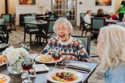 Residents enjoying a meal in the dining room