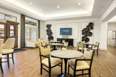 Bright common area with seating and decorative wall art