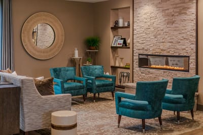 Comfortable common area with seating and a fireplace