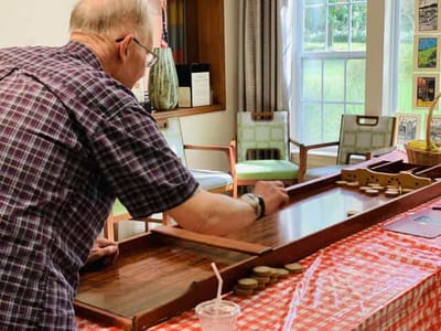 Resident playing a game in a communal area