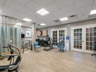 Interior view of a physical therapy room with equipment