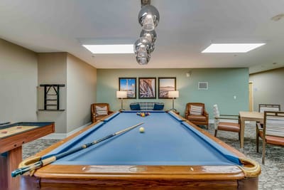 Interior view of a common area with a pool table